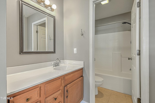 full bathroom featuring tile patterned floors, vanity, toilet, and bathtub / shower combination