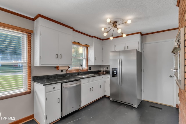 kitchen with stainless steel appliances, white cabinetry, a wealth of natural light, and sink