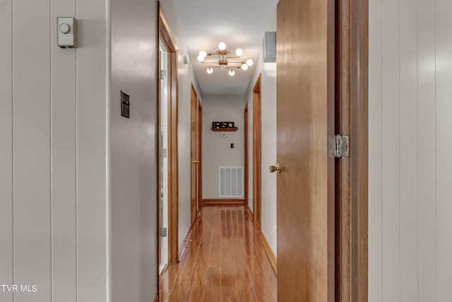 hall with light hardwood / wood-style floors