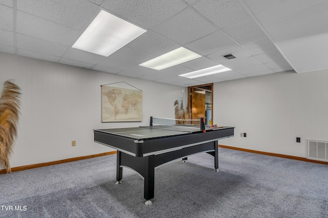 playroom with a paneled ceiling and carpet floors