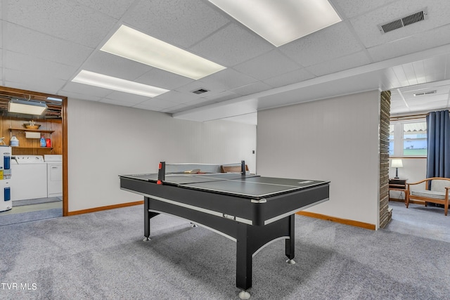 game room with washer and dryer, light carpet, a paneled ceiling, and electric water heater