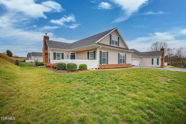 exterior space with a front yard and a garage