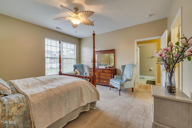 bedroom featuring ceiling fan and light carpet