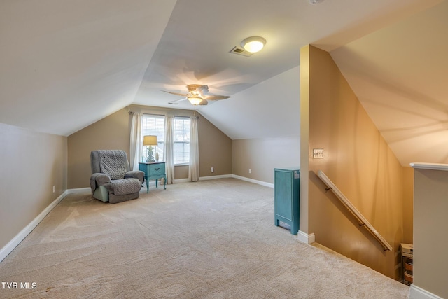 additional living space featuring ceiling fan, light colored carpet, and lofted ceiling