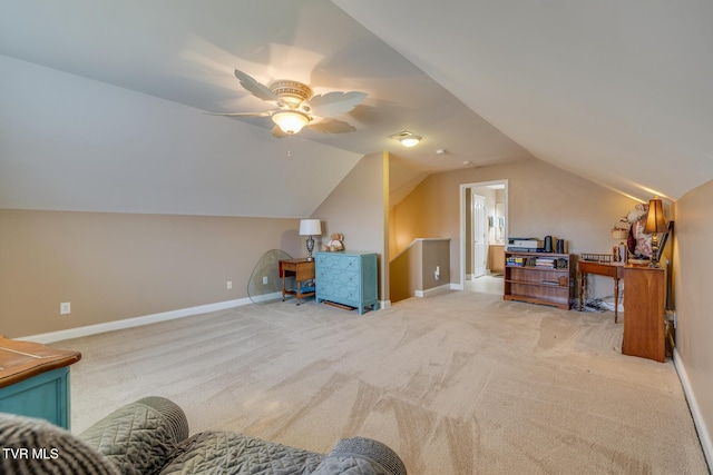 interior space featuring light colored carpet, ceiling fan, and lofted ceiling