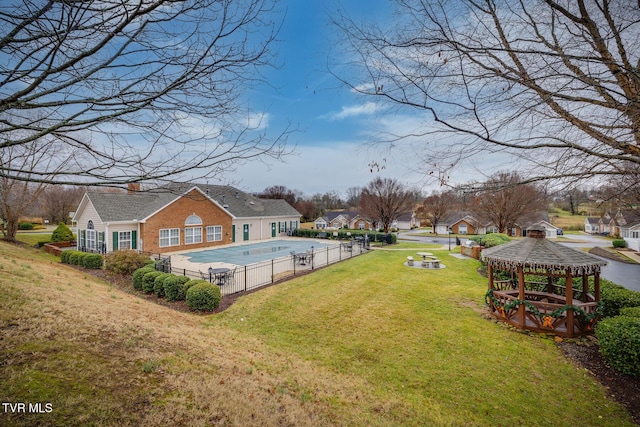 view of yard with a gazebo and a covered pool