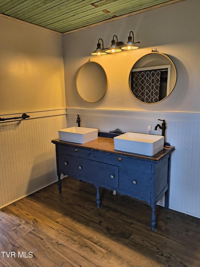 bathroom with hardwood / wood-style floors, vanity, and wood ceiling