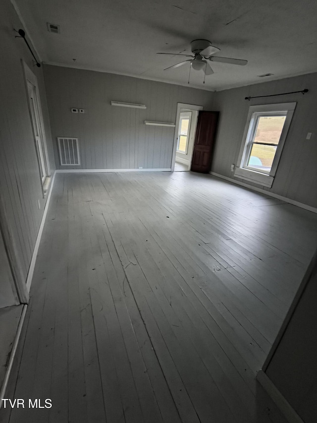 unfurnished room featuring ceiling fan and light hardwood / wood-style floors