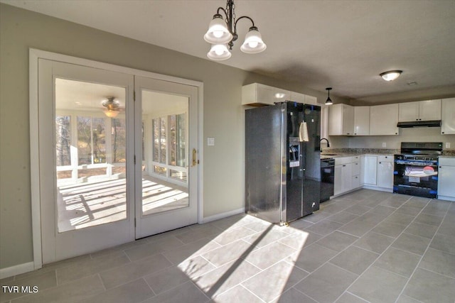 kitchen featuring sink, black appliances, pendant lighting, an inviting chandelier, and white cabinets