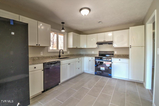 kitchen with a textured ceiling, sink, black appliances, decorative light fixtures, and white cabinets