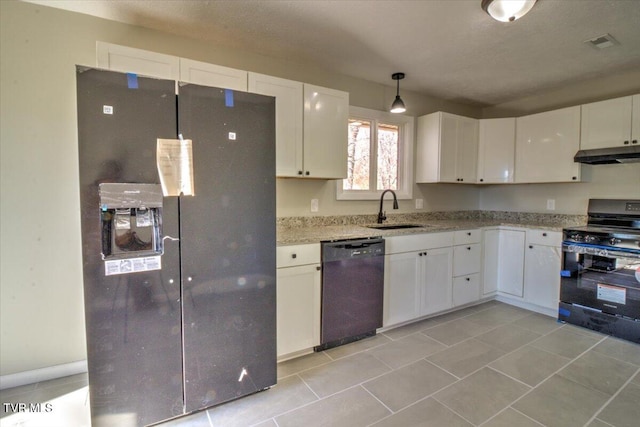 kitchen with light stone counters, sink, black appliances, pendant lighting, and white cabinets