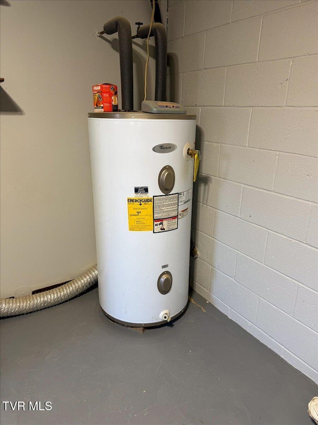 utility room featuring water heater