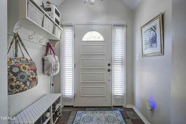 mudroom featuring lofted ceiling