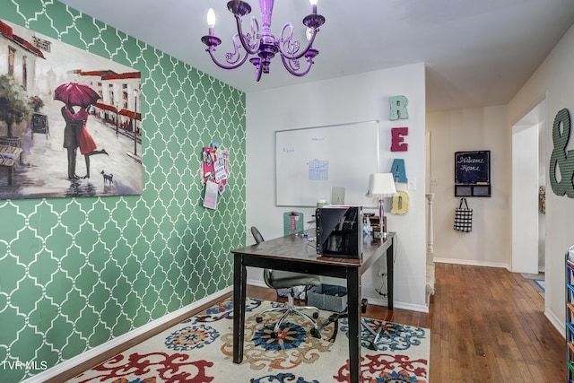 home office featuring a chandelier and wood-type flooring