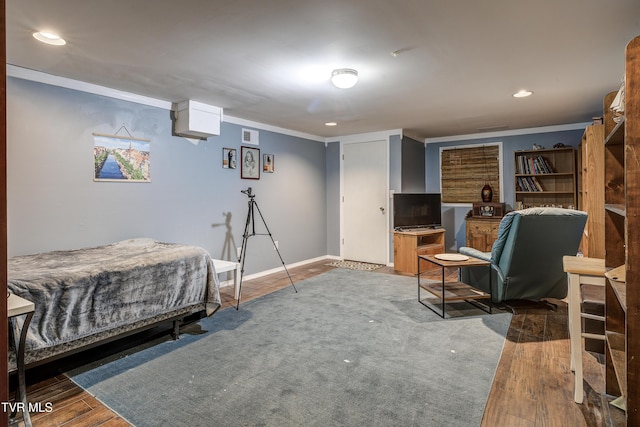 bedroom featuring dark hardwood / wood-style flooring and ornamental molding