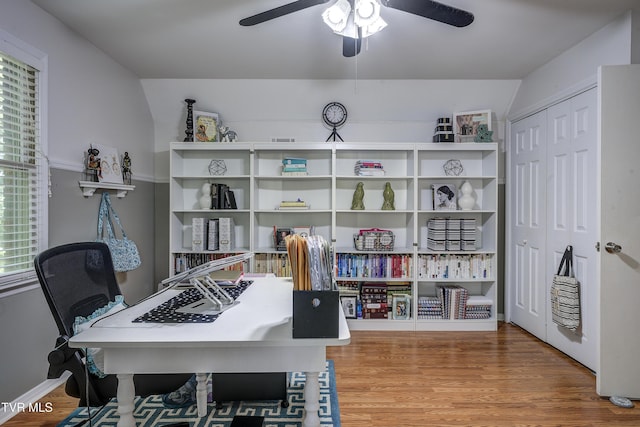 office with hardwood / wood-style floors and ceiling fan