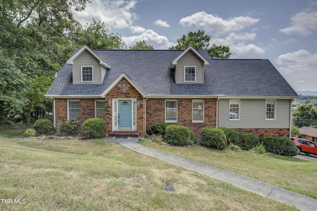 new england style home with a front lawn