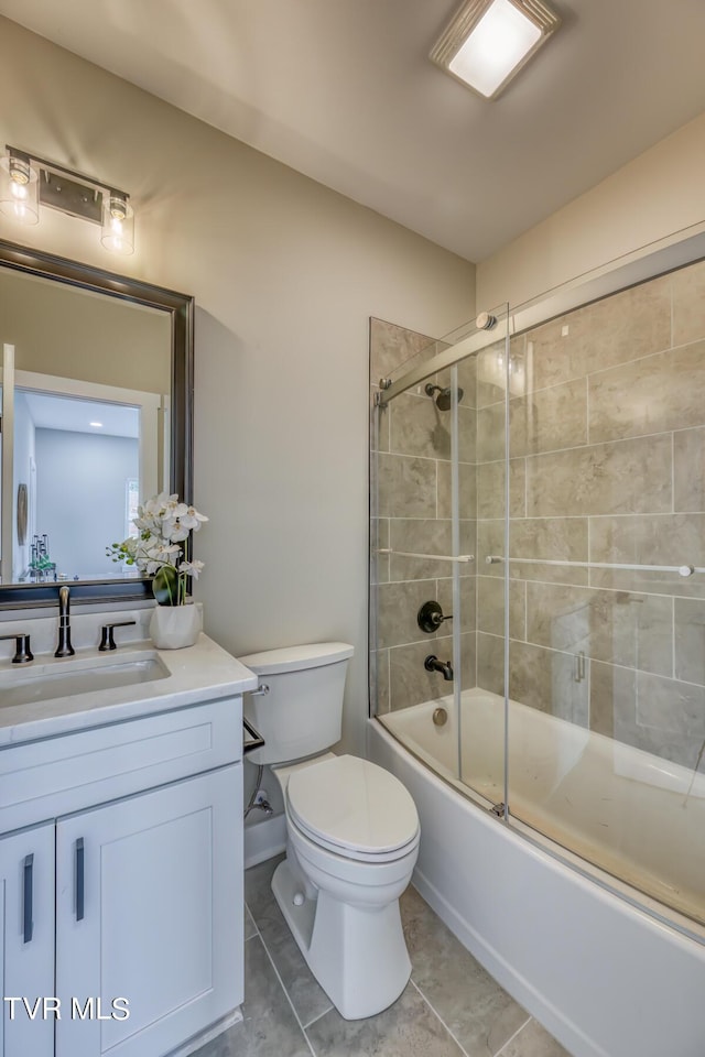 full bathroom featuring tile patterned flooring, vanity, toilet, and enclosed tub / shower combo