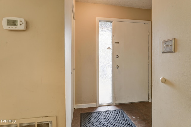 view of tiled foyer entrance