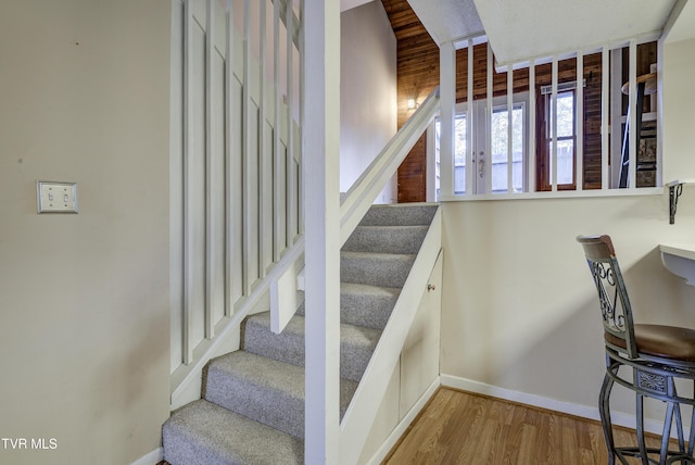 stairs with wood-type flooring