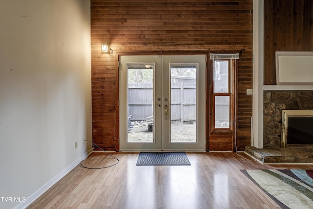 doorway to outside with french doors and light wood-type flooring