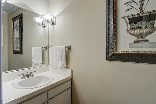 bathroom with vanity and ornamental molding