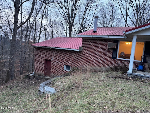 view of property exterior featuring a wall unit AC