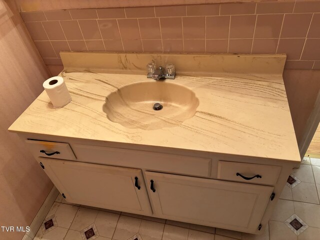 bathroom with tile patterned flooring and vanity