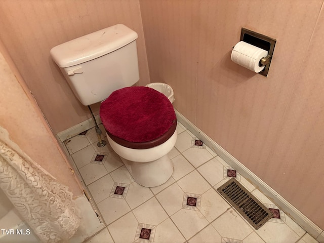 bathroom with tile patterned flooring and toilet