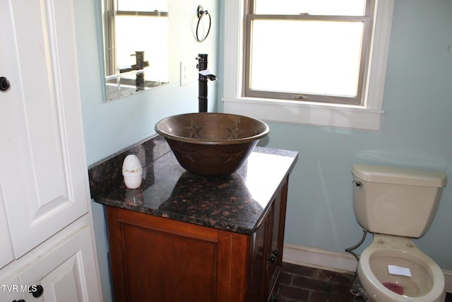 bathroom with vanity and toilet