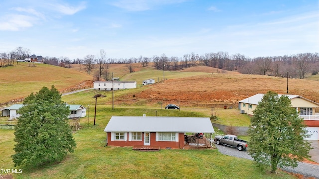 birds eye view of property with a rural view