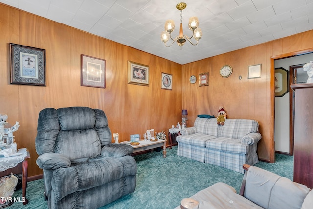 carpeted living room featuring wood walls and an inviting chandelier