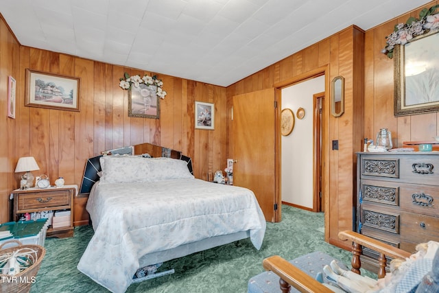 carpeted bedroom featuring wooden walls