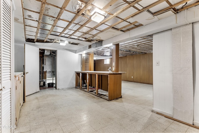 basement with wood walls