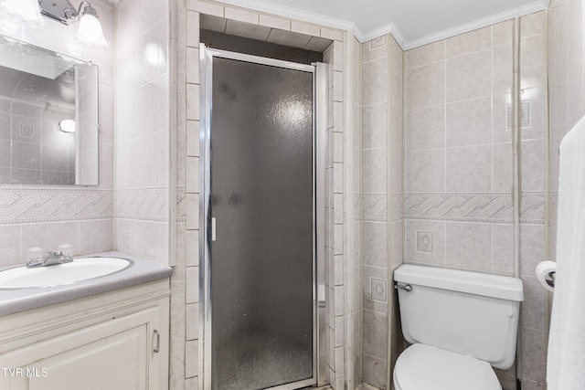 bathroom with tile walls, ornamental molding, vanity, walk in shower, and toilet