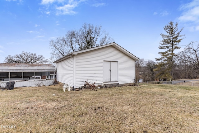 view of outdoor structure with a yard