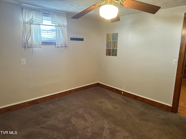 carpeted empty room featuring ceiling fan and a textured ceiling