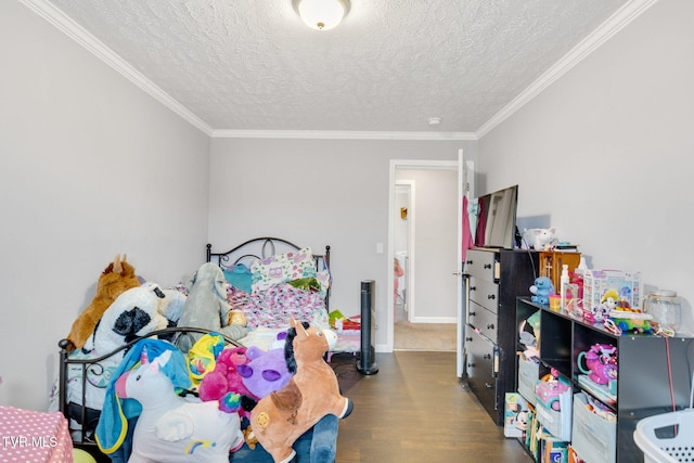 bedroom featuring crown molding, hardwood / wood-style floors, and a textured ceiling