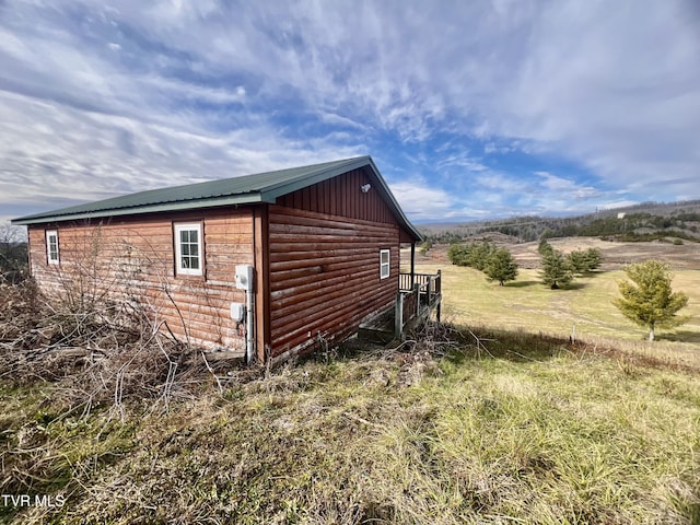 view of property exterior with a rural view