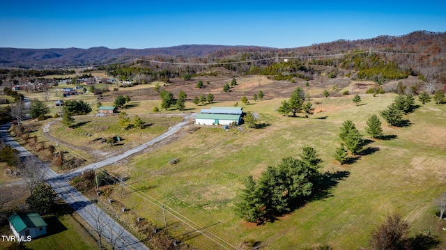 drone / aerial view featuring a mountain view and a rural view