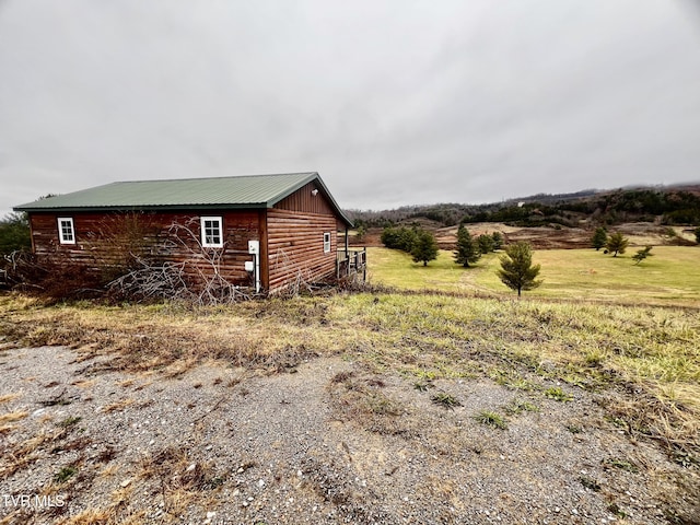 view of home's exterior featuring a rural view