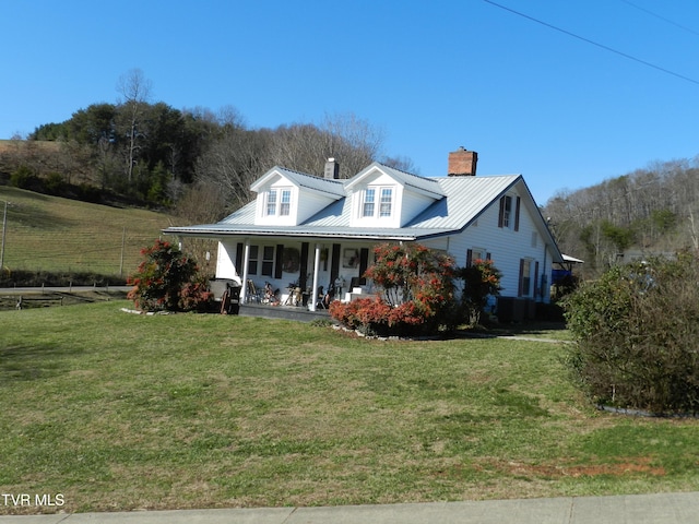 view of front of property with a porch and a front lawn