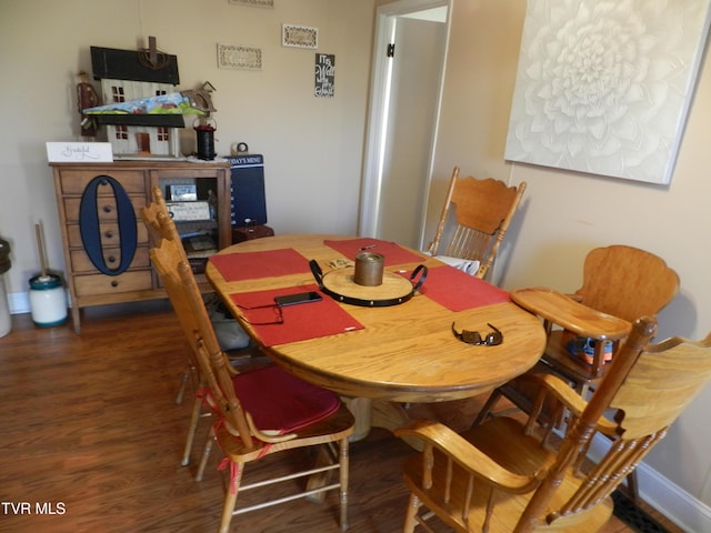 dining room featuring dark hardwood / wood-style flooring