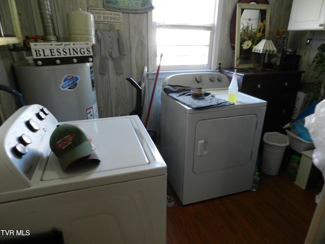 washroom with dark hardwood / wood-style floors, independent washer and dryer, and water heater