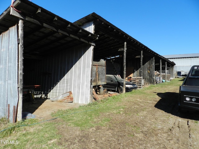 view of property exterior featuring an outbuilding