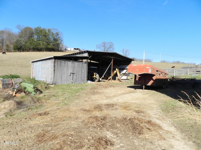 view of outdoor structure with a rural view