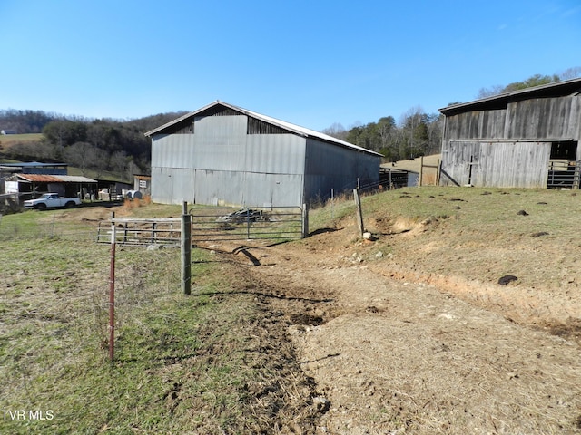 view of outbuilding with a rural view