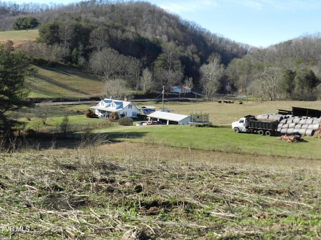 mountain view featuring a rural view