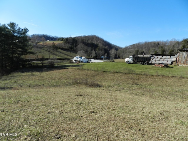 mountain view featuring a rural view