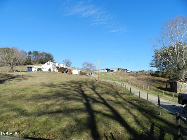 view of yard with a rural view